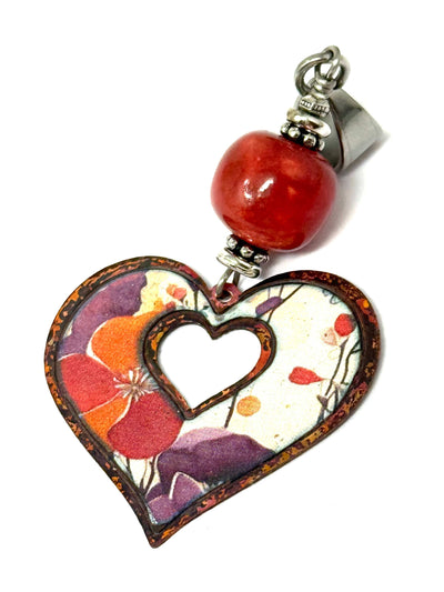 Gorgeous floral copper enamel bead enhanced with a coral color boho ceramic bead. Great for summer.