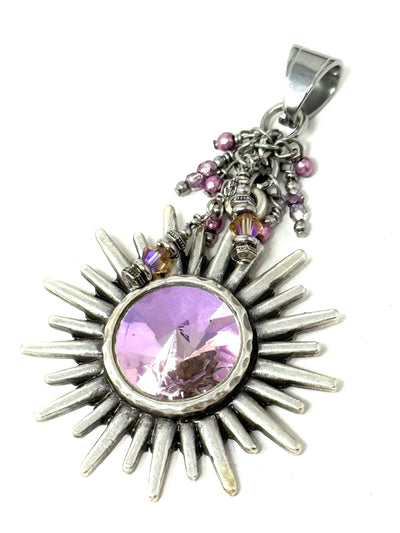Oxidized antique pewter sun pendant with a pink rainbow faceted crystal focal bead, adorned with dangling pink and purple seed beads and Swarovski crystals.