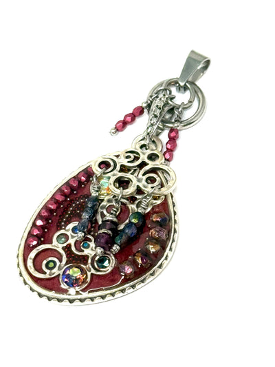 A deep red crystal and Czech glass beaded dangle pendant necklace featuring a unique interchangeable design.