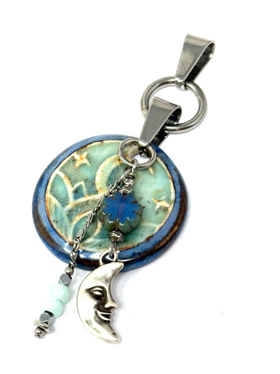 Crescent Moon Porcelain Interchangeable Pendant: This pendant features a dangling moon and glass beads. The nice interchangeable design allows for mixing and matching.