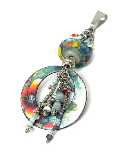 Floral copper enamel bead with a handmade lampwork glass bead created together for a unique pendant.