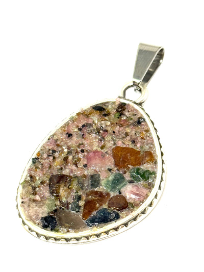 Colorful tourmaline beaded pendant created with an odd shaped pendant in a mosaic pattern.