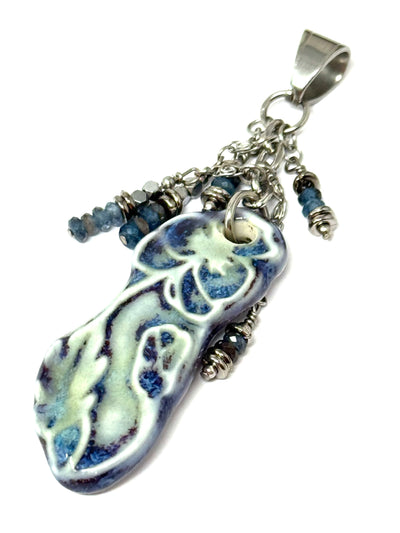 Handmade porcelain blue floral beaded pendant with silver accents, perfect for everyday wear and unique style.