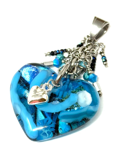 Chunky handmade lampwork glass heart pendant in vibrant blue with silver accents, perfect for stylish everyday wear.