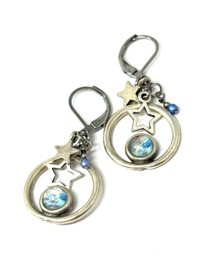 Handmade baby blue and white star glass earrings with silver details, perfect for everyday wear and special occasions.