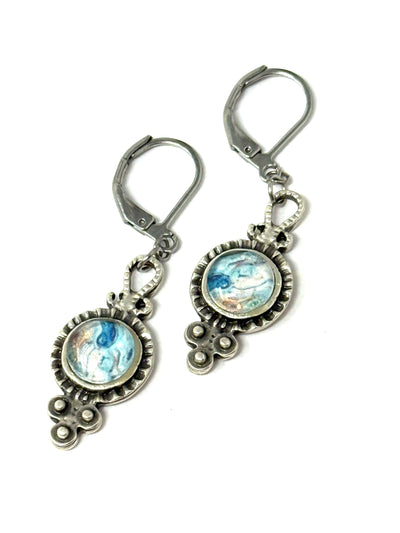 Handmade colorful glass filigree earrings with intricate silver detailing and blue accents.