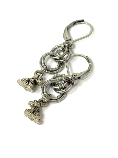 Handmade stainless steel dangle earrings featuring cute dog charms, lightweight and stylish for everyday wear.