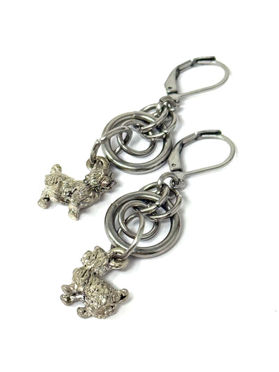 Handmade stainless steel dangle dog earrings featuring a cute dog charm, perfect for everyday wear.