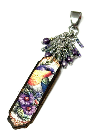 Handmade long floral bird pendant with beaded cluster design, perfect for everyday wear and accessorizing.