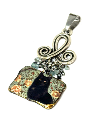 Handmade black cat porcelain beaded dangle pendant with intricate floral design and elegant metal detailing.