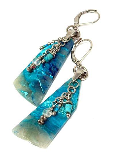 Handmade chrysocolla gemstone dangle earrings with silver accents, ideal for everyday wear or special occasions.