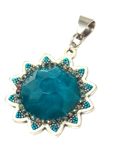 Handmade floral turquoise glass beaded pendant with a stunning sunburst design for stylish accessories.