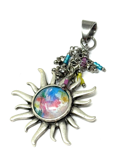 Handmade colorful glass sun beaded dangle pendant with vibrant hues, perfect for everyday accessorizing.
