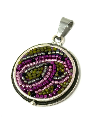 Handmade Glass Seed Bead Mosaic Pendant featuring a swirl design with purple and green beads.