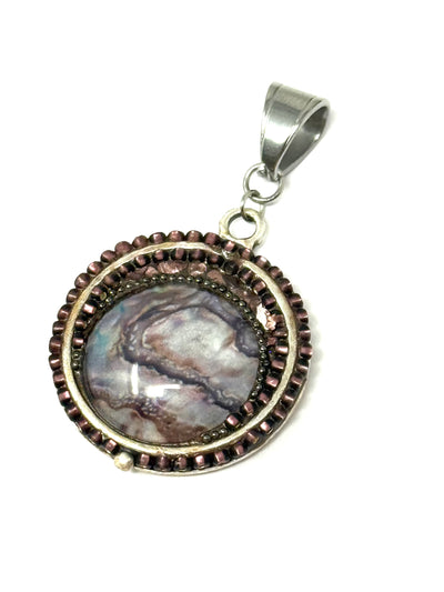 Handmade Brown Mosaic Beaded Pendant featuring intricate bead design and striking colors in a unique setting.