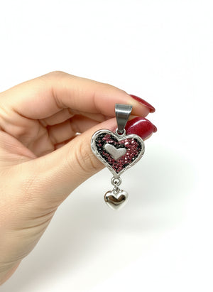 Heart-shaped pendant with black and pink frosted glass.
