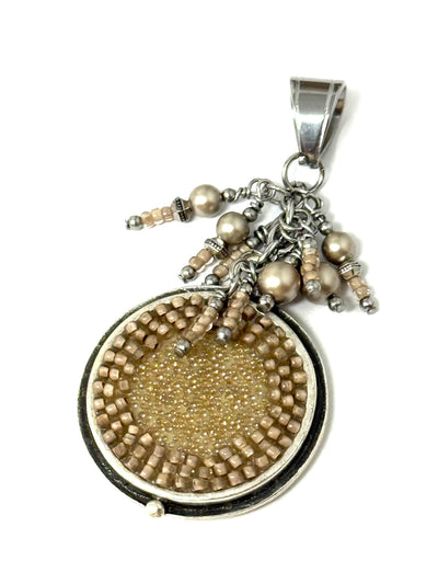 Handmade golden beige pearl and seed bead cascade pendant with shimmering glass focal bead, stainless steel bezel setting - front view on white background
