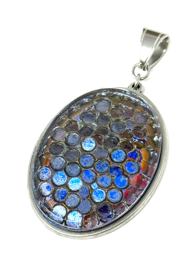 Vintage glass oval pendant in slate blue and bronze with circular pattern, set in stainless steel bezel - front view

