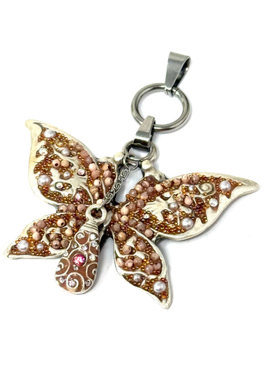 Handmade butterfly pendant necklace with intricate beadwork in shades of pink and silver, perfect for interchangeable jewelry.