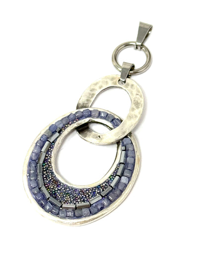 Handmade Tanzanite pendant necklace with intricate beadwork and silver detailing, ideal for unique style expression.
