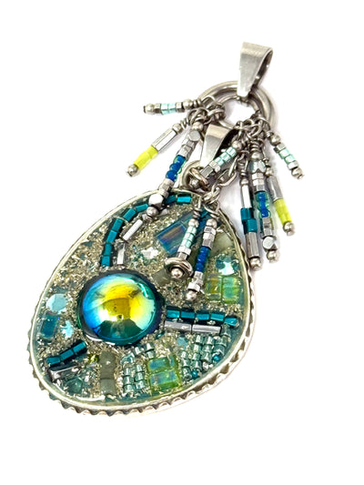Shimmering Teal Green Beaded Dangle Pendant is a must-have accessory. Mix and match your pendants with a single chain for endless style possibilities.